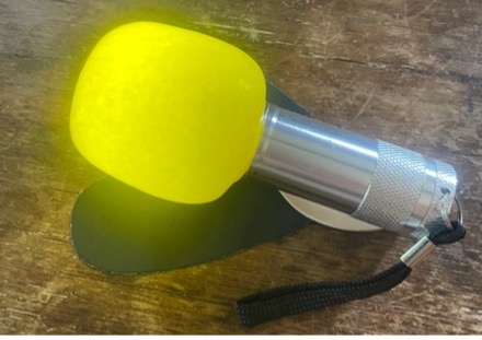 Yellow pool noodle flashlight